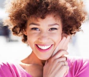 Young Woman Pink Shirt Dental Office Visits in Epping NH - Ozone Therapy Tamatha L Johnson Brentwood Dental Designs New Hampshire