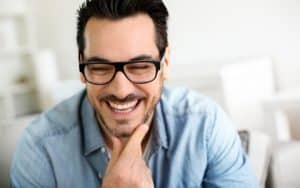 Man With Glasses Laughing - Smart Amalgam Removal Tamatha L Johnson Brentwood Dental Designs New Hampshire