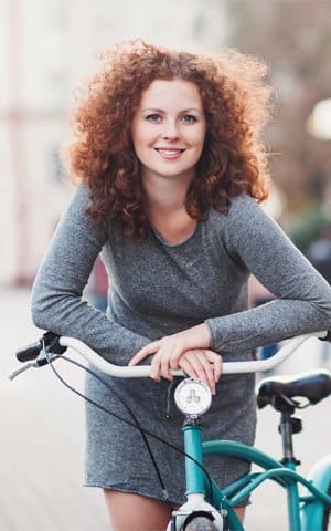 Smiling girl shows off her straight teeth near Rye, NH thanks to Invisalign clear braces.